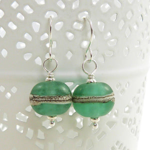 mint green lampwork glass and silver drop earrings