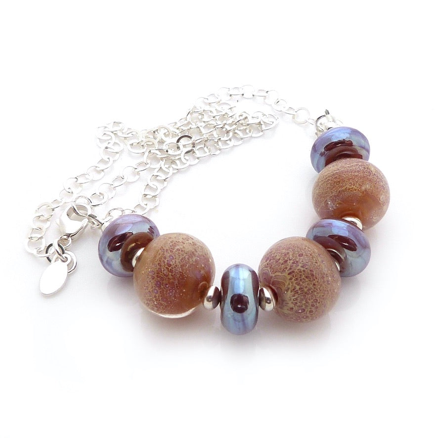 Peachy amber Lampwork glass necklace with silver chain