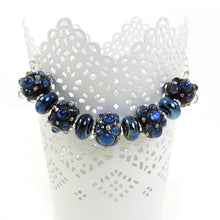 blue lampwork bead and silver necklace