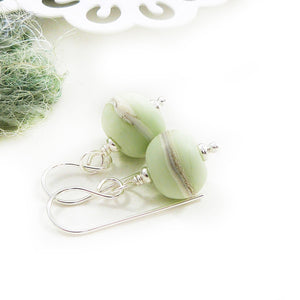 Pale green lampwork glass bead and silver drop earrings