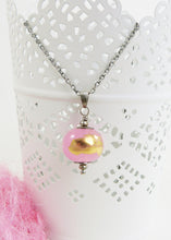 Pink lampwork glass with gold leaf bead pendant on an oxidised silver chain