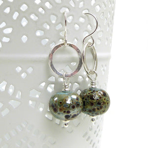 Duck Egg Blue speckled earrings with silver ring on a white background