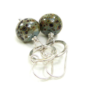 Duck Egg Blue speckled earrings with silver ring on a white background
