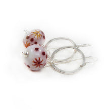 Red and White Bead earrings with silver ring on a white background