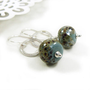 Duck Egg Blue speckled earrings with silver ring on a white background