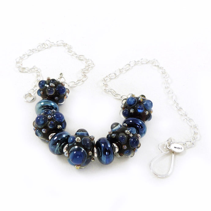 blue lampwork bead and silver necklace
