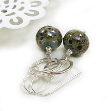 Duck Egg Blue speckled earrings with silver ring on a white background