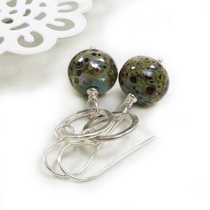 Duck Egg Blue speckled earrings with silver ring on a white background