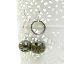 Duck Egg Blue speckled earrings with silver ring on a white background