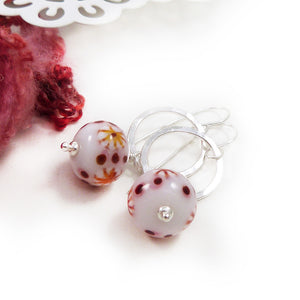 Red and White Bead earrings with silver ring on a white background