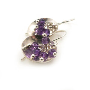Drop earrings with clusters of Purple Amethyst Gemstones in a sterling silver dish 