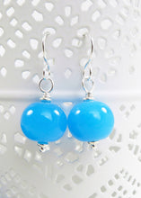 Bright blue glass bead and silver earrings