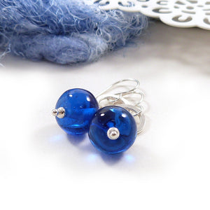 Bright blue glass bead and silver circle drop earrings