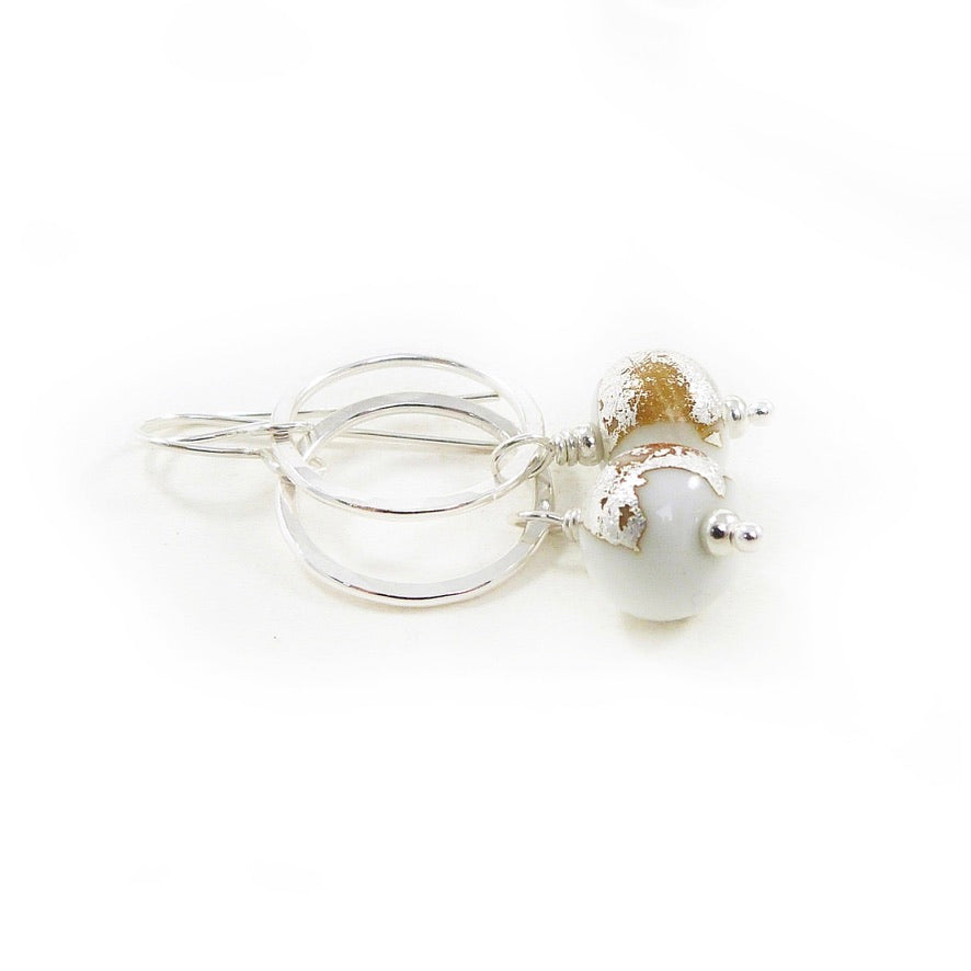 white lampwork glass bead and silver circle drop earrings