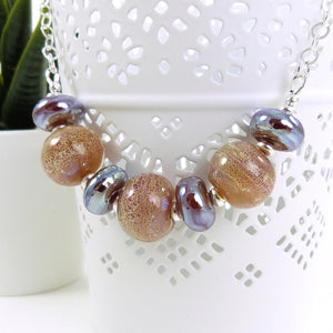 Peachy amber Lampwork glass necklace with silver chain
