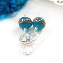 teal glass bead and silver circle drop earrings