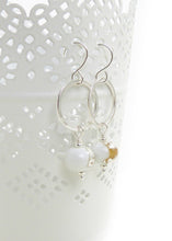 white lampwork glass bead and silver circle drop earrings